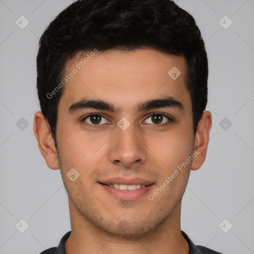 Joyful latino young-adult male with short  brown hair and brown eyes