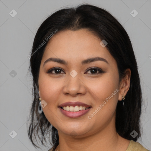 Joyful latino young-adult female with long  brown hair and brown eyes