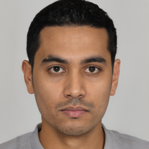 Neutral latino young-adult male with short  black hair and brown eyes