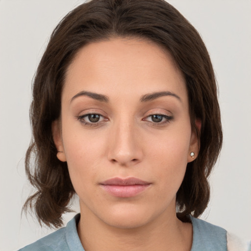 Neutral white young-adult female with medium  brown hair and brown eyes