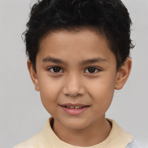 Joyful black child male with short  brown hair and brown eyes