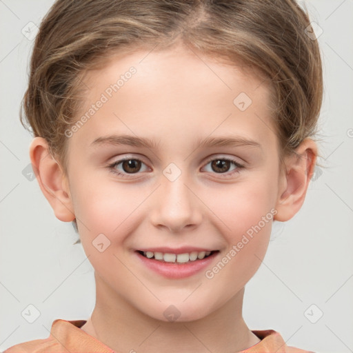 Joyful white child female with short  brown hair and brown eyes