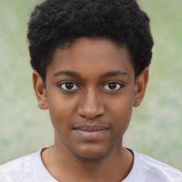 Joyful black child male with short  black hair and brown eyes
