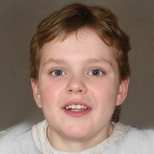 Joyful white child male with short  brown hair and blue eyes