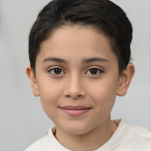 Joyful latino child female with short  brown hair and brown eyes