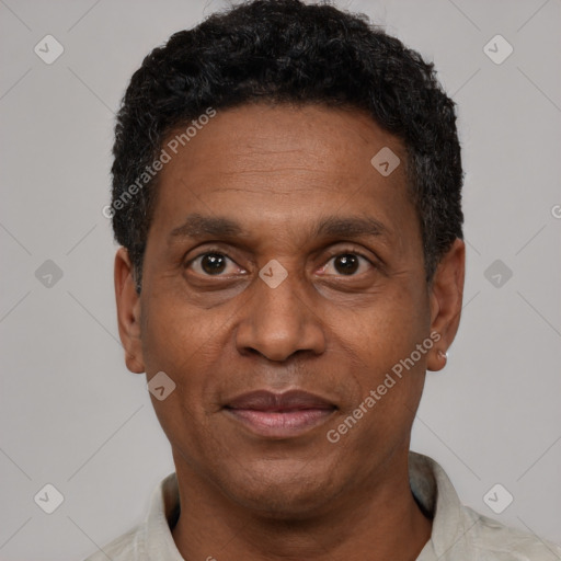 Joyful latino adult male with short  black hair and brown eyes