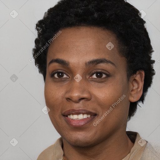 Joyful black young-adult female with short  brown hair and brown eyes