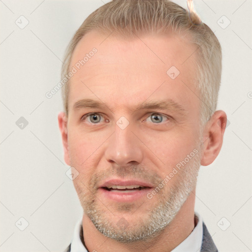 Joyful white adult male with short  brown hair and grey eyes