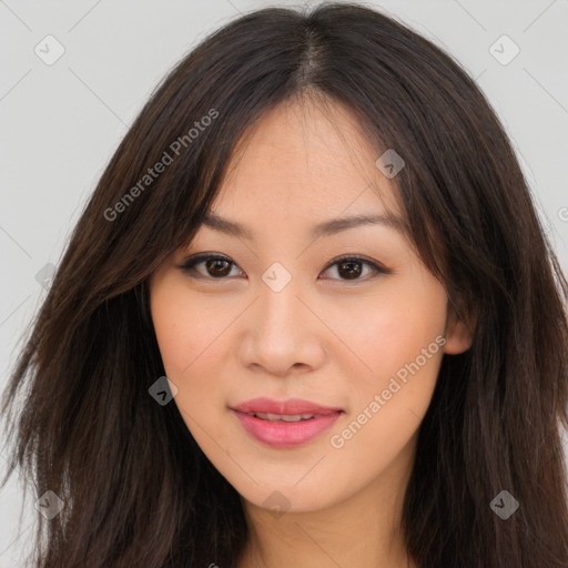 Joyful asian young-adult female with long  brown hair and brown eyes