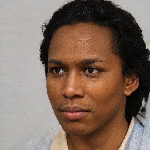 Neutral black young-adult female with short  black hair and brown eyes