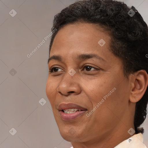 Joyful black adult female with short  brown hair and brown eyes