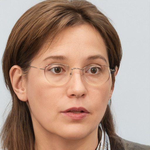 Neutral white adult female with long  brown hair and grey eyes