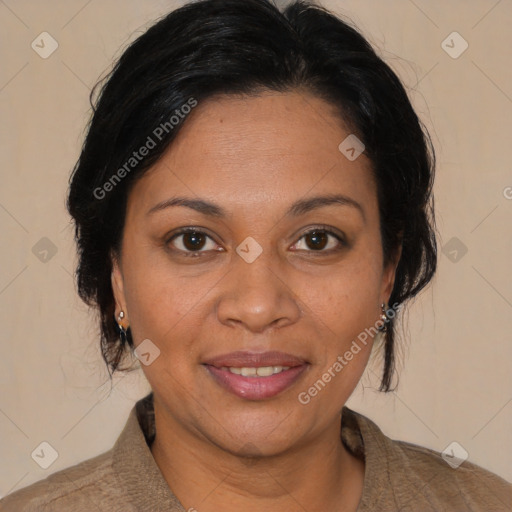 Joyful latino adult female with medium  brown hair and brown eyes