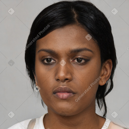 Neutral black young-adult female with medium  black hair and brown eyes