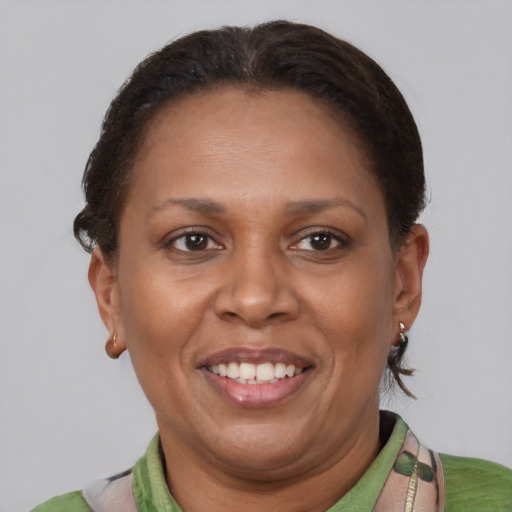 Joyful latino adult female with short  brown hair and brown eyes