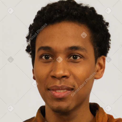 Joyful black young-adult male with short  black hair and brown eyes