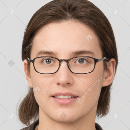 Joyful white young-adult female with medium  brown hair and grey eyes