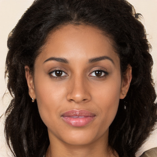 Joyful latino young-adult female with long  brown hair and brown eyes