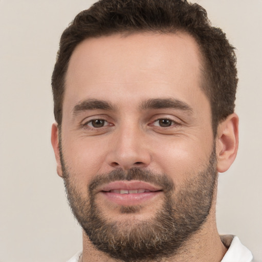 Joyful white young-adult male with short  brown hair and brown eyes