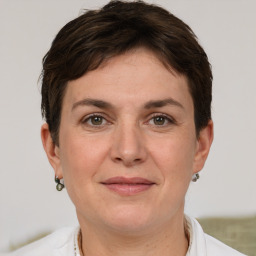 Joyful white adult female with short  brown hair and brown eyes