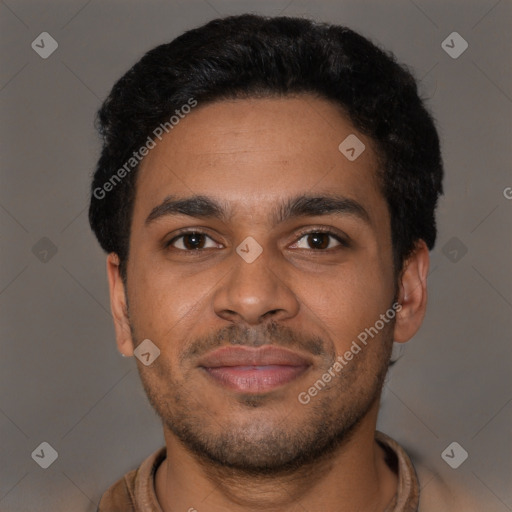 Joyful black young-adult male with short  brown hair and brown eyes