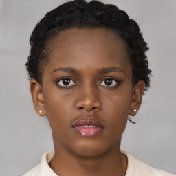 Neutral black young-adult female with short  brown hair and brown eyes