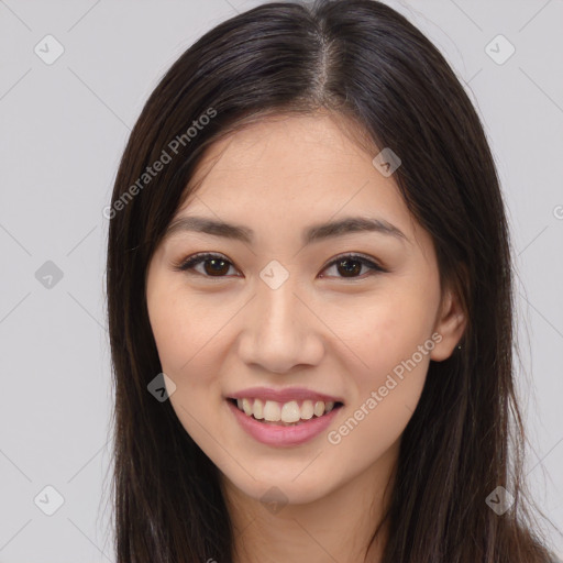 Joyful asian young-adult female with long  brown hair and brown eyes