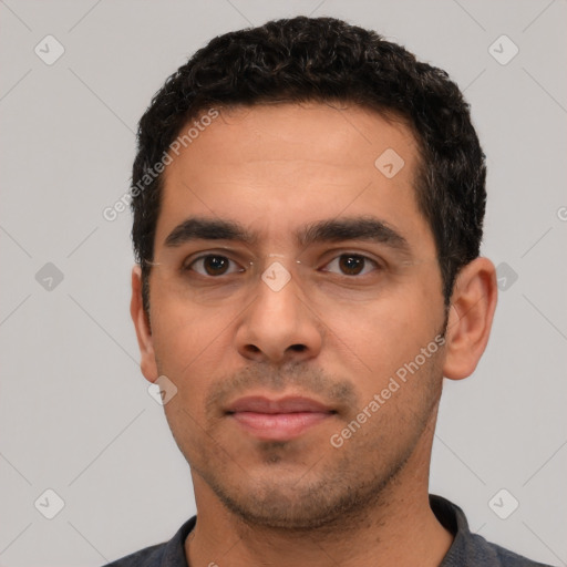 Neutral white young-adult male with short  black hair and brown eyes