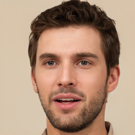 Joyful white young-adult male with short  brown hair and brown eyes