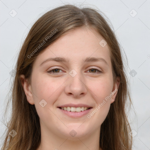 Joyful white young-adult female with long  brown hair and green eyes