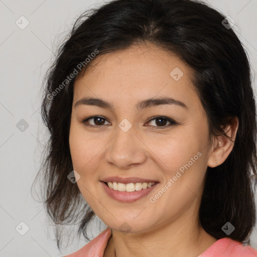 Joyful latino young-adult female with medium  brown hair and brown eyes