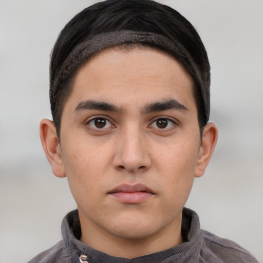Neutral white young-adult male with short  black hair and brown eyes