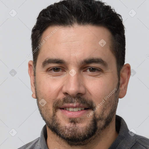 Joyful white adult male with short  brown hair and brown eyes