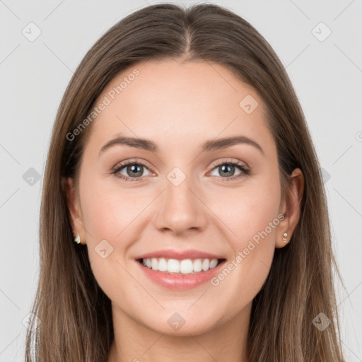 Joyful white young-adult female with long  brown hair and grey eyes