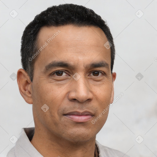 Neutral latino adult male with short  black hair and brown eyes