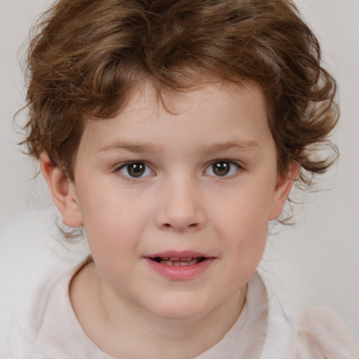 Joyful white child male with medium  brown hair and brown eyes