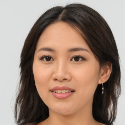 Joyful asian young-adult female with medium  brown hair and brown eyes