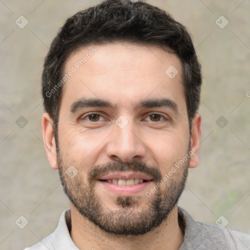 Joyful white young-adult male with short  black hair and brown eyes