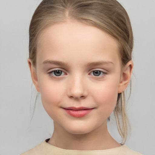 Joyful white child female with medium  brown hair and brown eyes