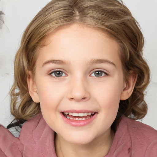 Joyful white child female with medium  brown hair and blue eyes