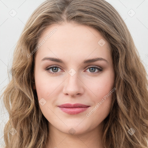 Joyful white young-adult female with long  brown hair and green eyes