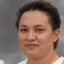 Joyful white adult female with short  brown hair and brown eyes