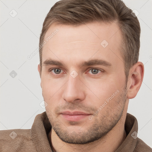 Neutral white young-adult male with short  brown hair and grey eyes