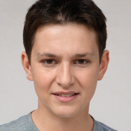 Joyful white young-adult female with short  brown hair and grey eyes