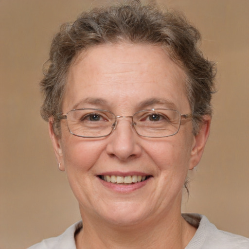 Joyful white middle-aged female with short  brown hair and brown eyes