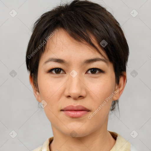 Joyful asian young-adult female with short  brown hair and brown eyes