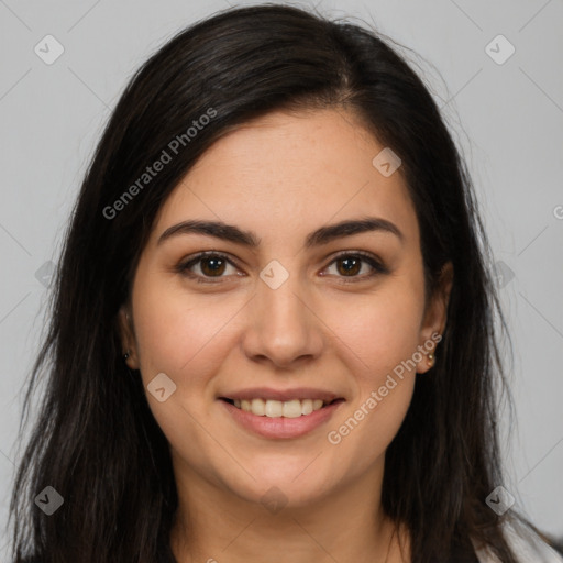 Joyful latino young-adult female with long  brown hair and brown eyes