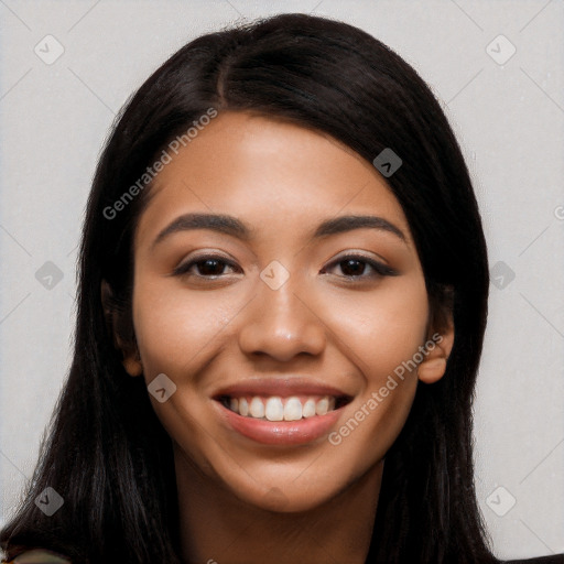 Joyful latino young-adult female with long  black hair and brown eyes