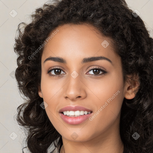 Joyful white young-adult female with long  black hair and brown eyes