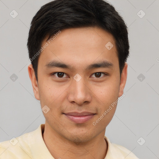 Joyful white young-adult male with short  black hair and brown eyes